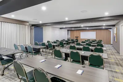 a conference room with tables and chairs and a whiteboard at Comfort Inn & Suites Irvine Spectrum in Lake Forest