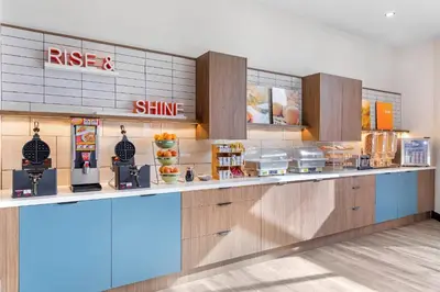 a fast food restaurant with a counter with food at Comfort Inn & Suites Irvine Spectrum in Lake Forest