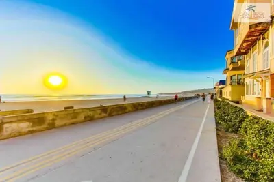 a street next to a beach with a sunset at 201-Surf Stars Studio in San Diego