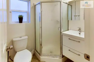 a bathroom with a shower and a toilet and a sink at 201-Surf Stars Studio in San Diego