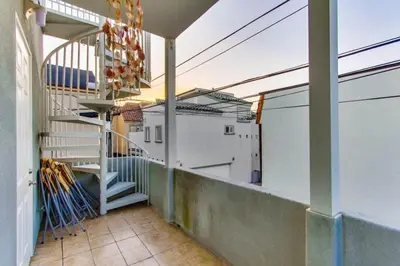 a balcony with a staircase on a building at 199-Surf Stars Combo in San Diego
