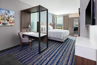 a hotel room with a bed and a desk at SpringHill Suites by Marriott Escondido Downtown in Escondido