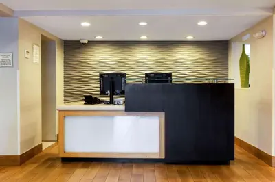 a counter in a room with a wall with at La Quinta by Wyndham San Diego Mission Bay in San Diego