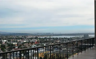 a view of a city from a balcony at Capri Beach Accommodations at Capri By The Sea in San Diego