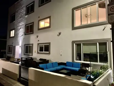 a room with blue chairs and a building at 102-Luxury2 in San Diego