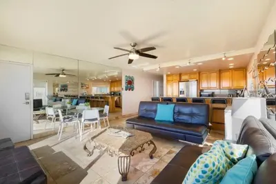 a living room with a couch and a table at 102-Luxury2 in San Diego