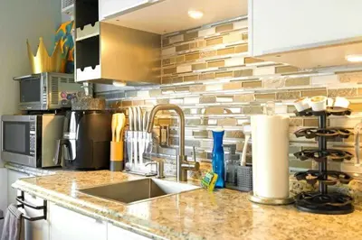 a kitchen with a sink and a counter top at 107-Oceanfront Lux 17 in San Diego