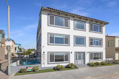 an exterior view of a white building at 107-Oceanfront Lux 17 in San Diego