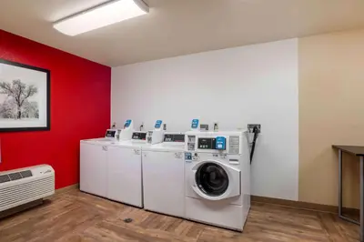 a laundry room with a washer and dryer at Extended Stay America Suites - Orange County - Lake Forest in Foothill Ranch