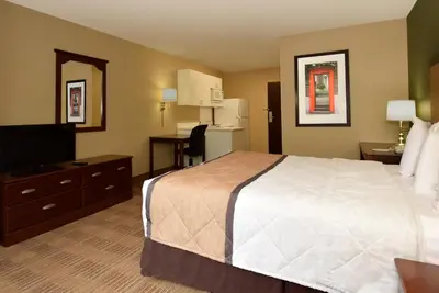 a hotel room with a bed and a television at Extended Stay America Suites - Orange County - Lake Forest in Foothill Ranch