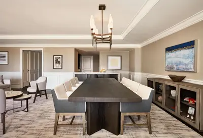 a dining room and living room with a table and chairs at Park Hyatt Aviara in Carlsbad