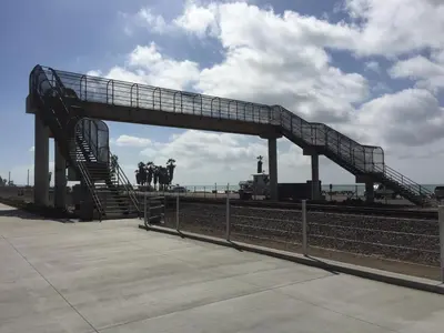 a metal ramp with a train on the tracks at Capistrano SurfSide Inn in Capistrano Beach
