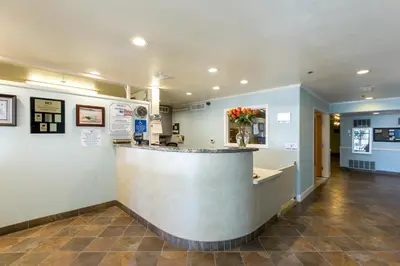a lobby with a bar in a pharmacy at Capistrano SurfSide Inn in Capistrano Beach