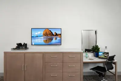 a flat screen tv sitting on top of a desk at Ayres Hotel San Diego South - Chula Vista in Chula Vista