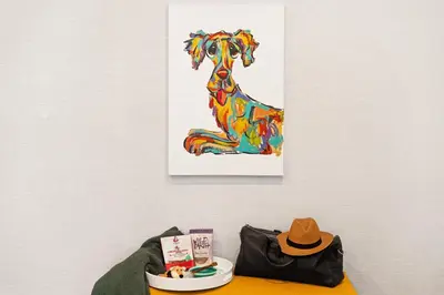a painting of a dog on a wall with a hat at Ayres Hotel San Diego South - Chula Vista in Chula Vista