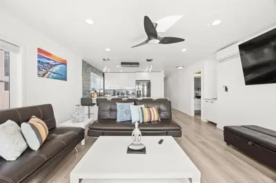 a living room with a couch and a table at 103-Luxury3 in San Diego