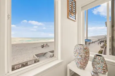 a window in a room with a view of a beach at 103-Luxury3 in San Diego