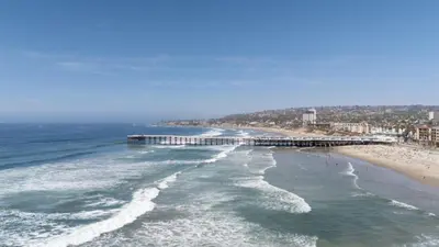 an aerial view of a beach with a pier at 103-Luxury3 in San Diego