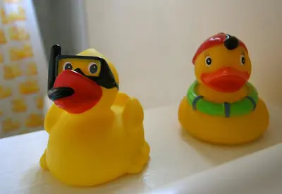 two rubber ducks sitting next to each other on a counter at The Tides Laguna Beach in Laguna Beach