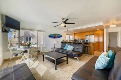 a living room with a couch and a table at 108-Ocean Front Combo in San Diego