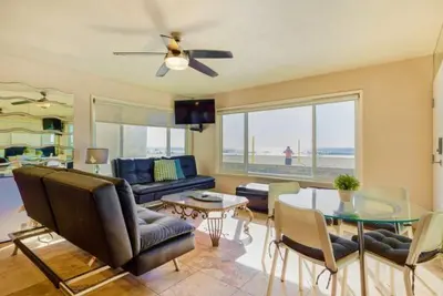 a living room with a couch and a table at 108-Ocean Front Combo in San Diego