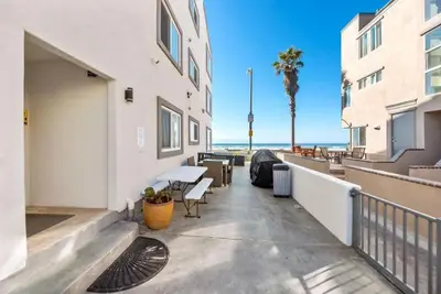 a balcony of a building with a view of the beach at 108-Ocean Front Combo in San Diego