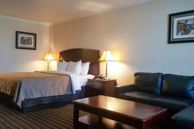a hotel room with a bed and a couch at Quality Inn Temecula Valley Wine Country in Temecula