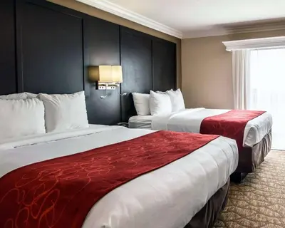 a hotel room with two beds and a window at Comfort Suites San Clemente Beach in San Clemente