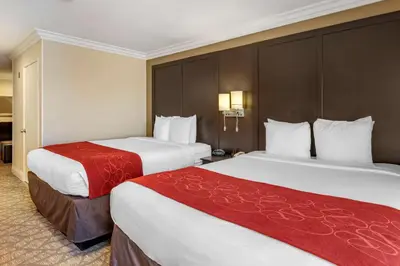 two beds in a hotel room with two at Comfort Suites San Clemente Beach in San Clemente
