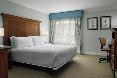 a hotel room with a bed and a window at Best Western Premier Hotel Del Mar in San Diego