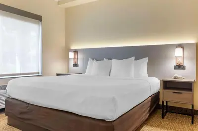a large white bed in a hotel room at Comfort Suites Oceanside Camp Pendleton Area in Oceanside