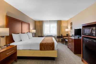 a hotel room with a bed and a flat screen tv at Comfort Inn & Suites Murrieta Temecula Wine Country in Murrieta