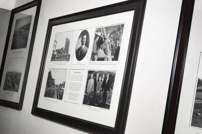 a framed picture offamous photographs hangs on a wall at Ayres Suites Mission Viejo - Lake Forest in Mission Viejo