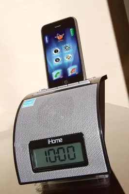 an alarm clock with a phone on top of it at Ayres Hotel Laguna Woods - Aliso Viejo in Laguna Woods