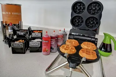 a pancake grill with waffles on top of it at Hampton Inn Chula Vista Eastlake in Chula Vista