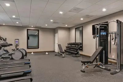 a gym with treadmills and exercise equipment in a room at Hampton Inn Chula Vista Eastlake in Chula Vista