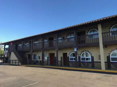 a building with balconies on the side of it at Hacienda Motel in Escondido