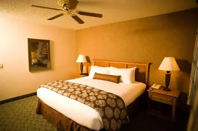 a hotel room with a large bed and two lamps at Borrego Springs Resort in Borrego Springs
