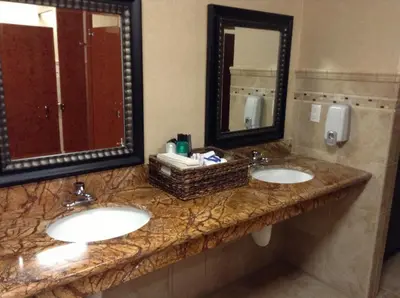 a bathroom with two sinks and two mirrors at Borrego Springs Resort in Borrego Springs