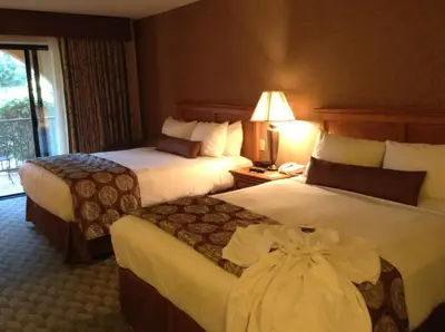 a hotel room with two beds and a lamp at Borrego Springs Resort in Borrego Springs