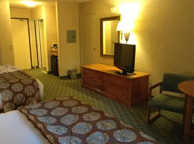 a hotel room with a bed and a flat screen tv at Borrego Springs Resort in Borrego Springs