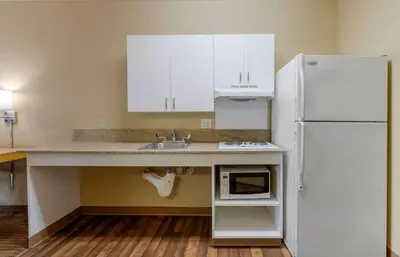 a kitchen with a sink and a refrigerator at Extended Stay America Suites - Temecula - Wine Country in Temecula