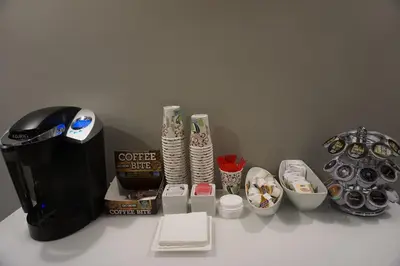a counter with a coffee maker and other items on it at Crescent Bay Inn in Laguna Beach
