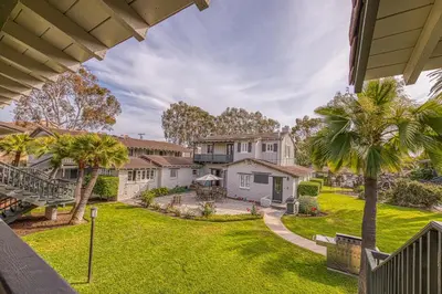 an aerial view of a house with a yard at Heart of the Village in Carlsbad