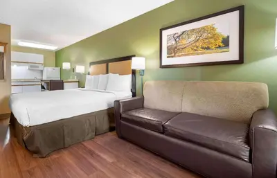 a hotel room with a bed and a couch at Extended Stay America Suites - San Diego - Fashion Valley in San Diego