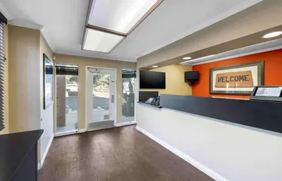 a lobby with a reception desk and a television at Extended Stay America Suites - San Diego - Fashion Valley in San Diego