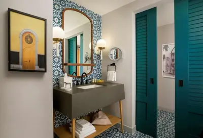 a bathroom with a sink and a mirror at The Monsaraz San Diego, Tapestry Collection By Hilton in San Diego