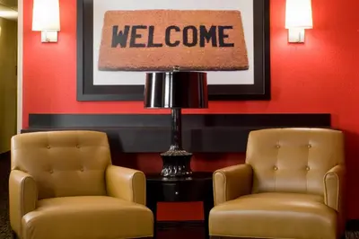 two chairs and a lamp in a waiting room at Extended Stay America Suites - Orange County - John Wayne Airport in Newport Beach