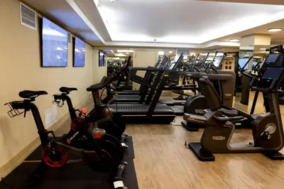 a gym with several treadmills and exercise bikes at The Lodge at Torrey Pines in San Diego