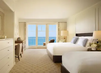 a hotel room with two beds and a view of the ocean at Montage Laguna Beach in Laguna Beach